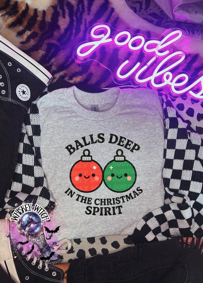 Close-up of cute Christmas ornament faces and rounded text on funny holiday sweatshirt