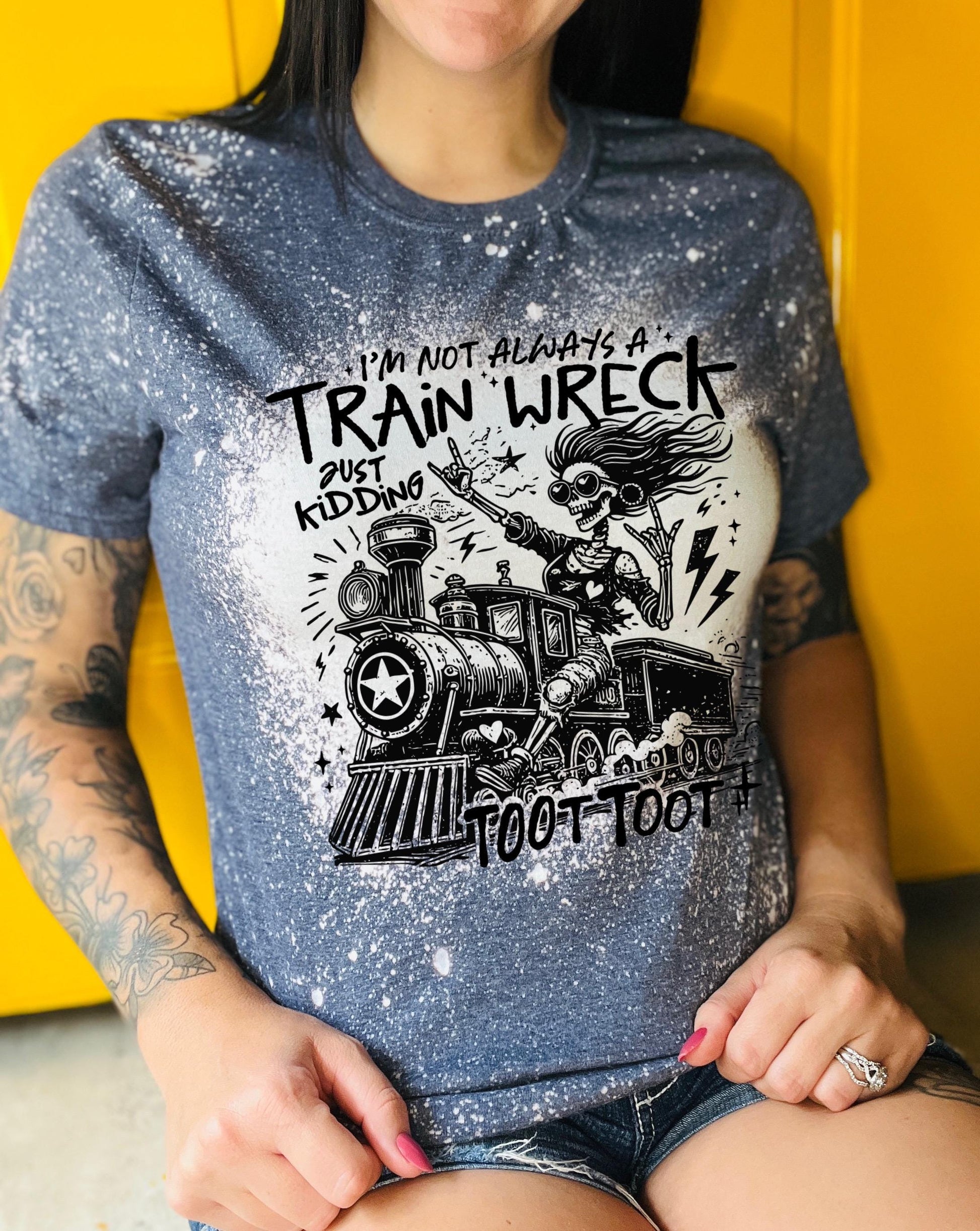 Bleached handmade graphic T-shirt with funny train wreck skeleton design and black text that says I’m not always a train wreck just kidding toot toot.
