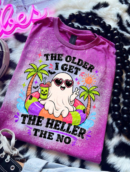 bleached handmade T-shirt with a cute ghost on a colorful pool floatie, palm trees, sunglasses, and funny black text reading The Older I Get The Heller The No.