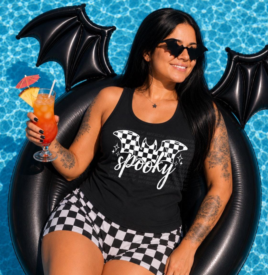 Handmade black spooky bat tank top with a white checkered graphic, perfect for goth summer outfits, pool days, vacations, and spooky cute everyday style.